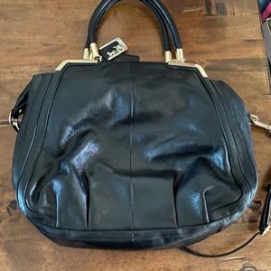 Coach large black leather bag.